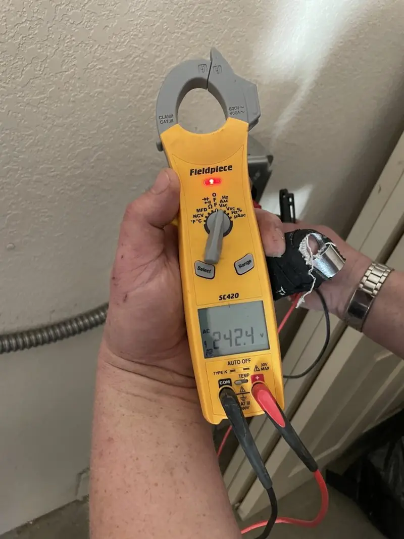 Voltage testing with clamp meter during Electrical Installation Services in Pinewood